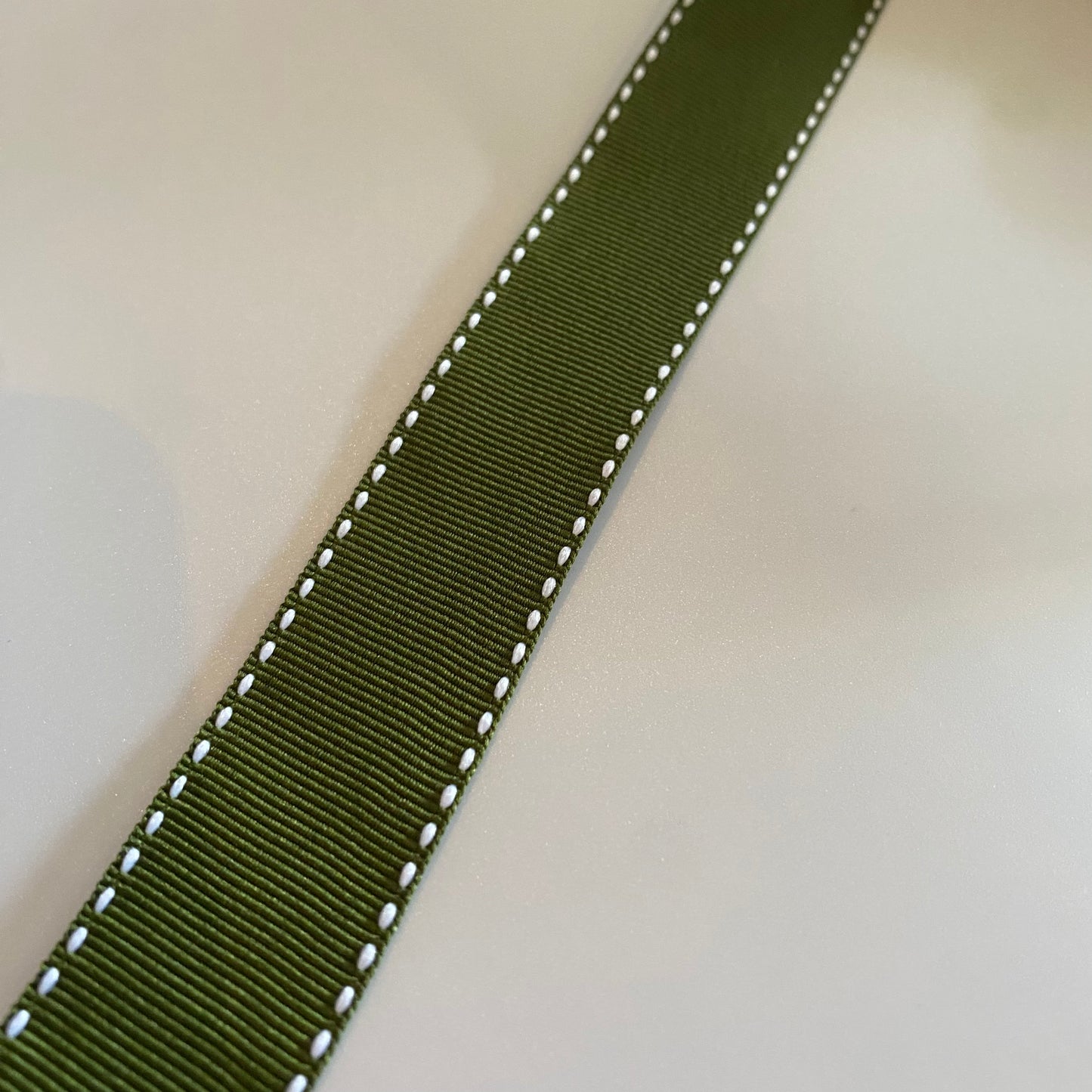 Green Ribbon White Stitching