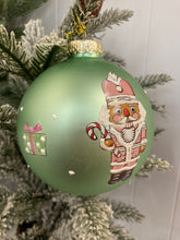 Load image into Gallery viewer, Glass Bauble with Nutcrackers