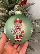 Load image into Gallery viewer, Glass Bauble with Nutcrackers